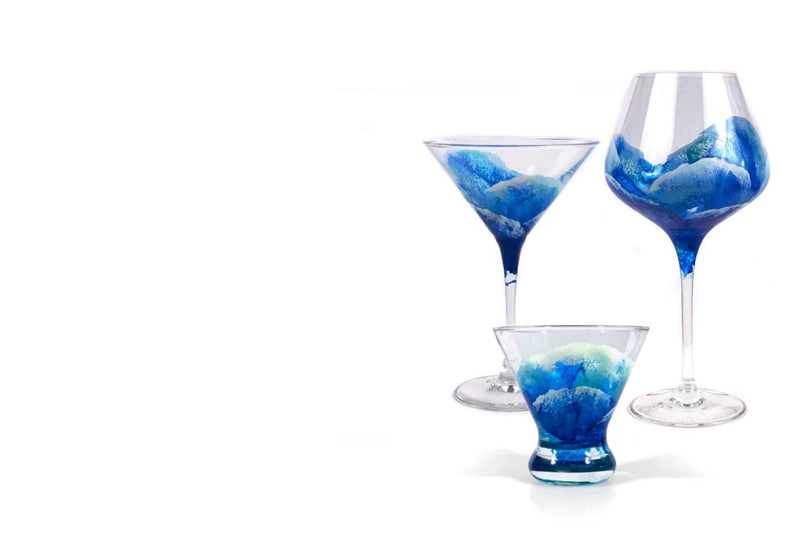 Trio of Nautilus Glassware style hand-painted cocktail glasses wrapped in blue and white ocean waves by Nelson Makes Art