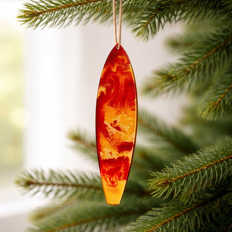 season of gold surfboard ornament hanging on christmas tree