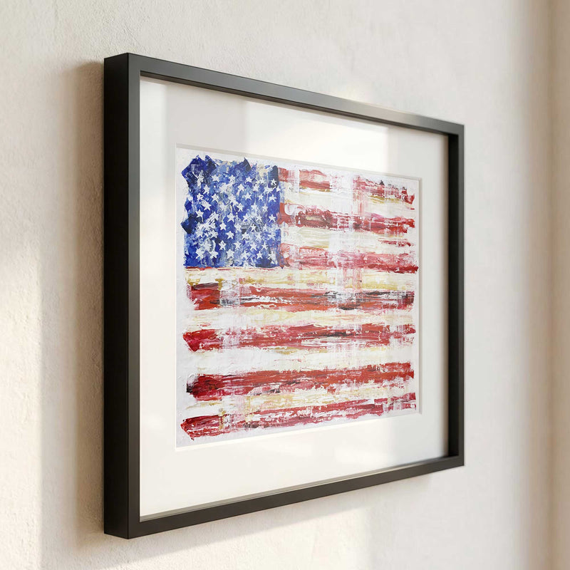 Framed abstract American flag painting displayed in a modern interior with clean black frame and white mat