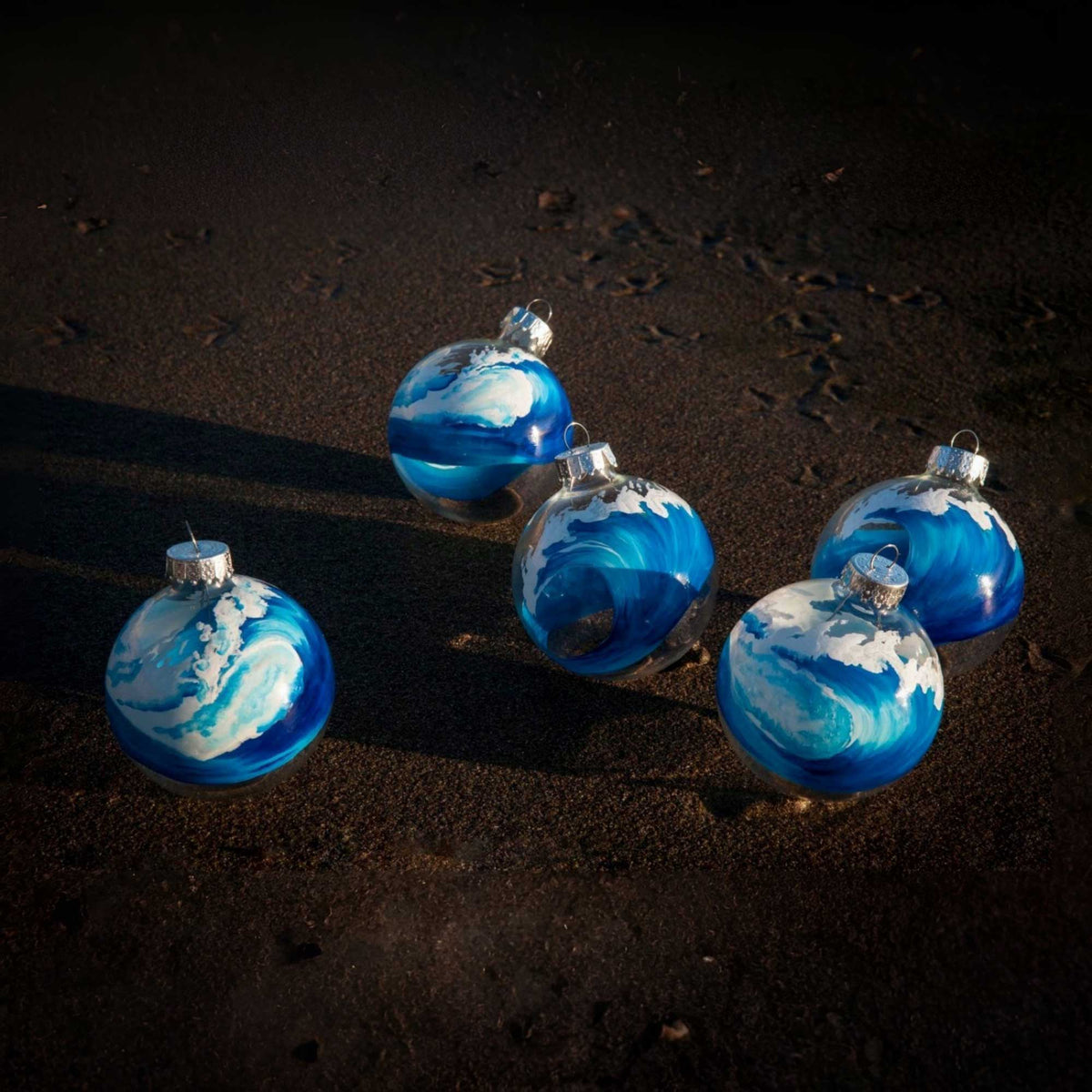group of bluewater glass wave ornaments showing swell and break editions