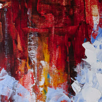 Close up detail of red and gold textured paint layers behind abstract ocean wave artwork