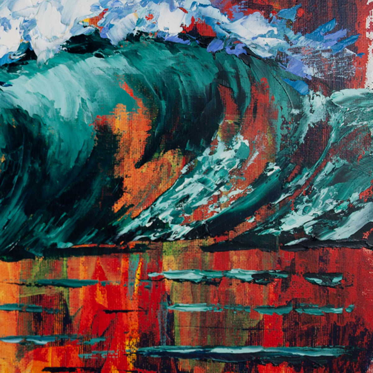 Close-up detail of emerald green curling wave reflecting red and orange sunset tones