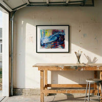Capsule Tale 3 framed abstract ocean wave artwork displayed in sunlit coastal garage studio