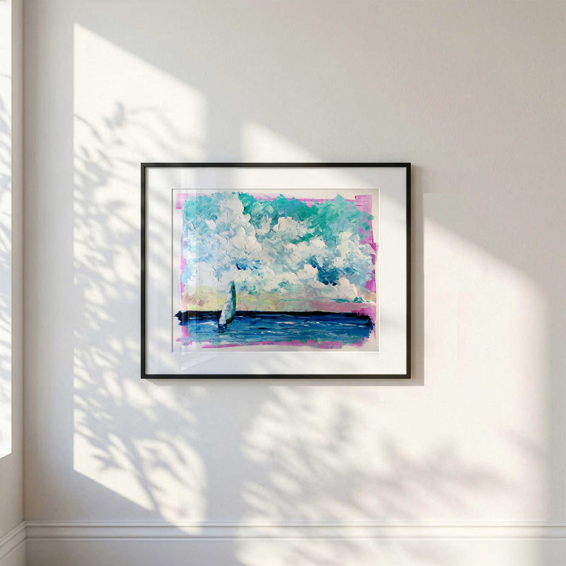 Framed abstract sailboat coastal painting displayed in sunlit modern interior with soft shadows