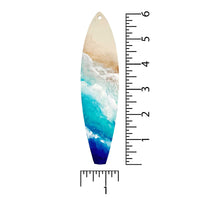 dimensions of castaway surfboard holiday ornament shown with ruler