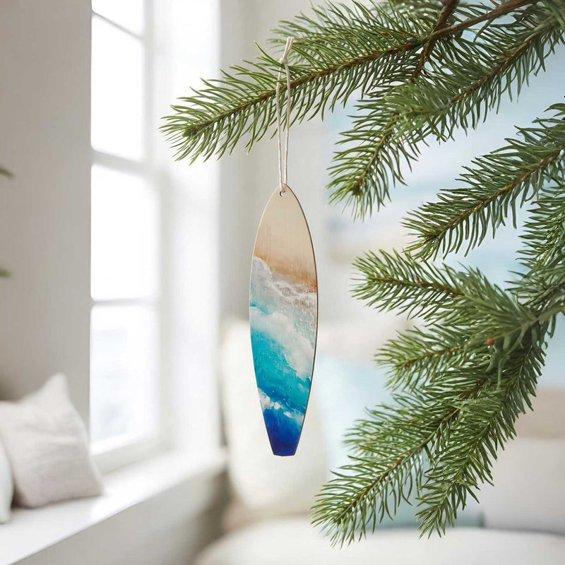 Decorative Castaway surfboard ornament hanging on a holiday tree