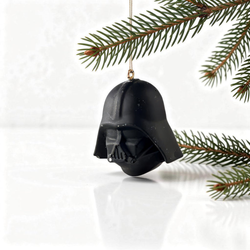 darth vader helmet holiday ornament hanging on christmas tree branch for star wars fans