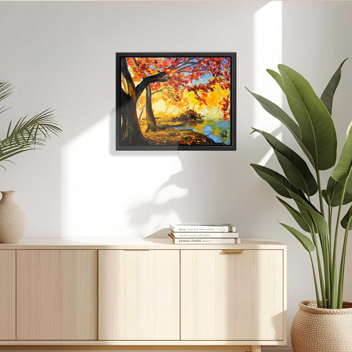 Elysium framed autumn painting hanging above a modern light wood console in a sunlit room.