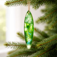 Emerald Sea surfboard ornament hanging on christmas tree