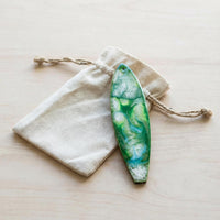 emerald sea surfboard holiday ornament with canvas bag and twine