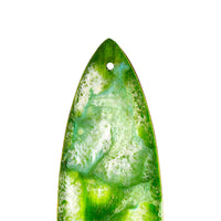 close up of emerald green resin texture on surfboard ornament