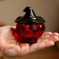 Miniature Witch House Halloween Decor in an open hand for scale