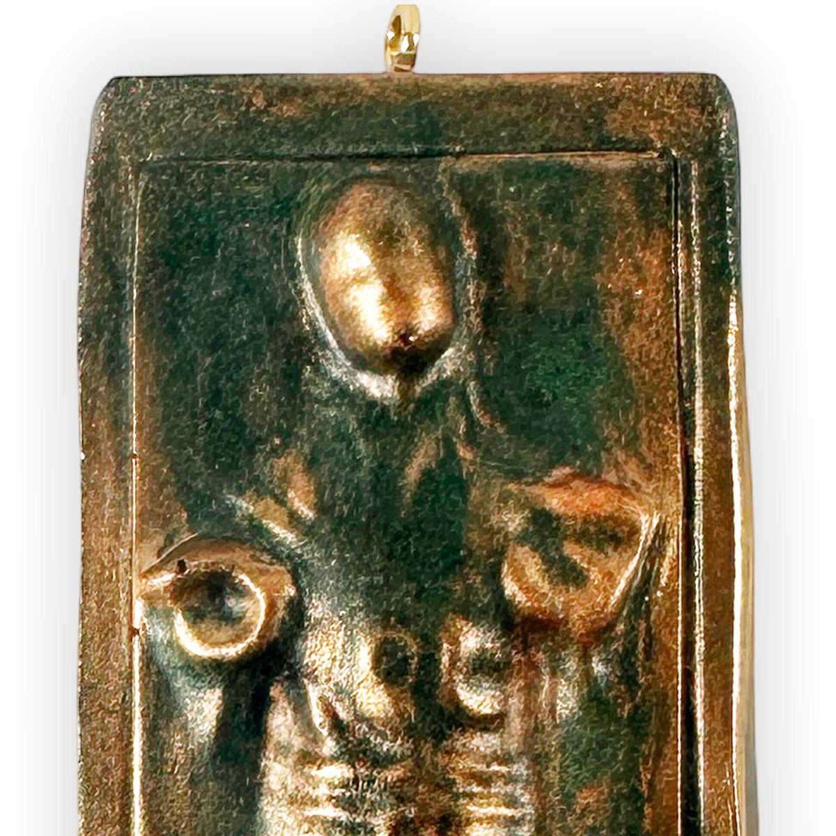 top section closeup of han solo carbonite ornament showing face and raised sculpted details