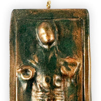 top section closeup of han solo carbonite ornament showing face and raised sculpted details
