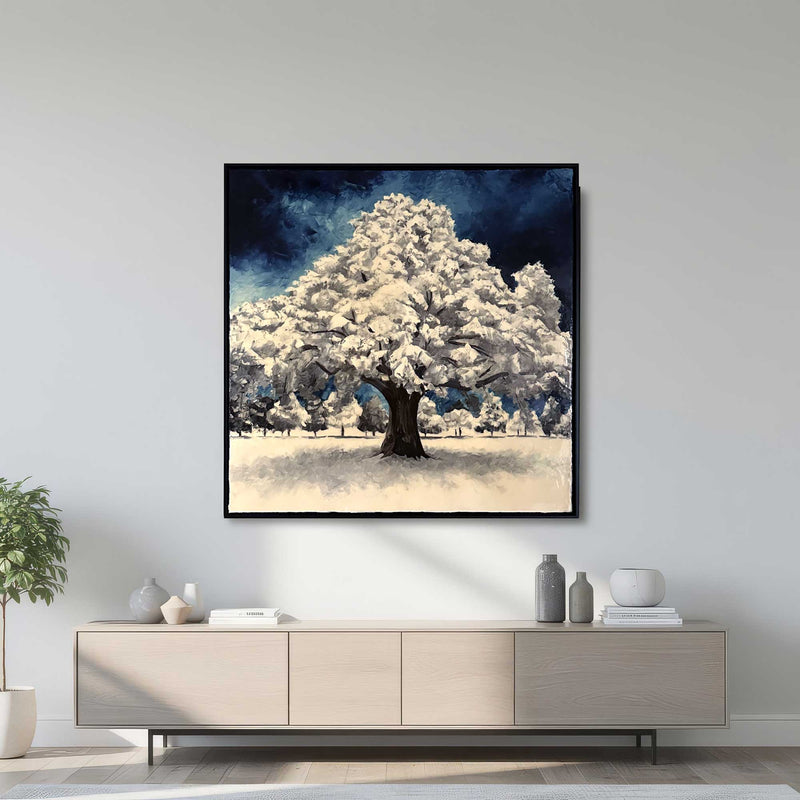 Large framed winter tree oil painting displayed above modern console table in contemporary living room