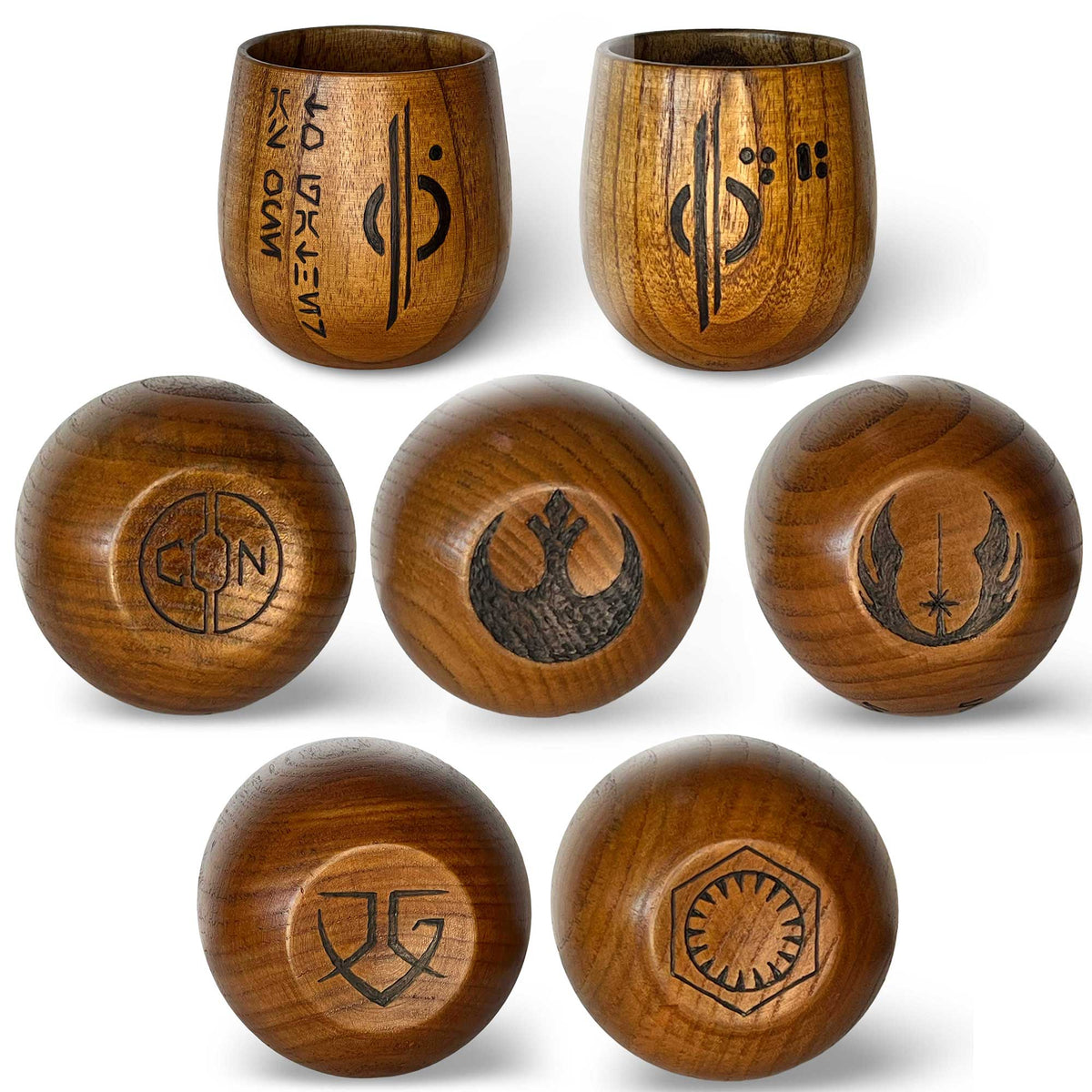 Multiple Halcy-Con 2025 Exclusive Kar’tam Cups displaying different Aurebesh tenets burned into handcrafted wood
