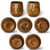 Multiple Halcy-Con 2025 Exclusive Kar’tam Cups displaying different Aurebesh tenets burned into handcrafted wood