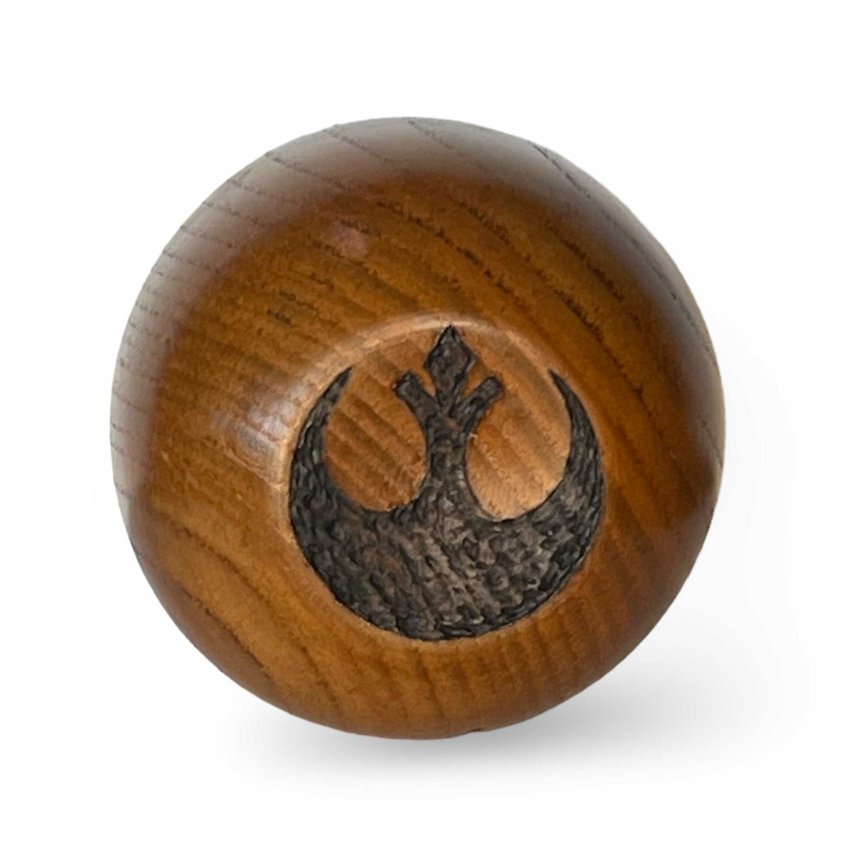 Bottom of wooden Kar’tam cup featuring Resistance Rebel faction symbol burned into base