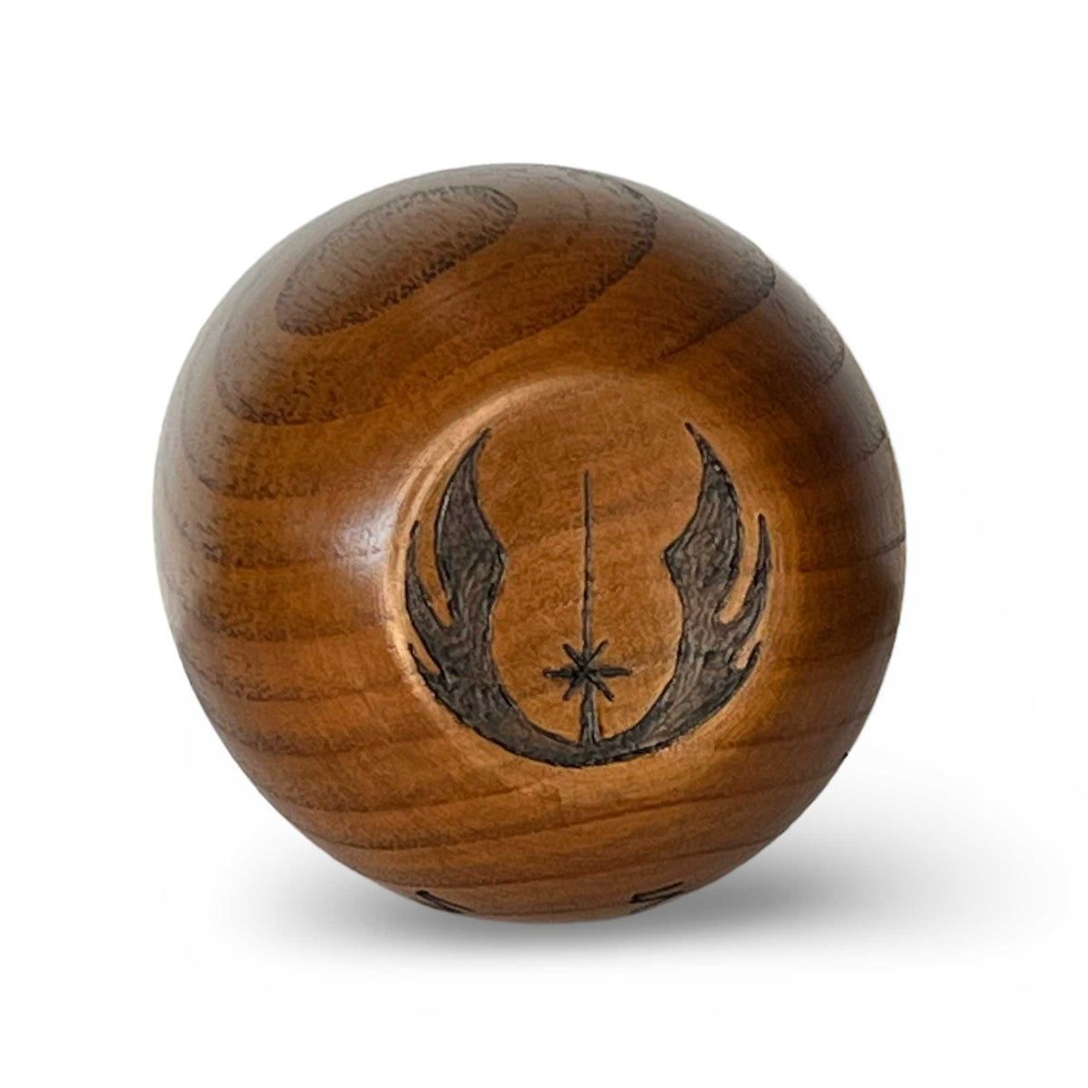 Bottom of wooden Kar’tam cup featuring Saja Jedi faction symbol burned into base