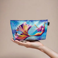 mermaid makeup bag held in a hand for size reference