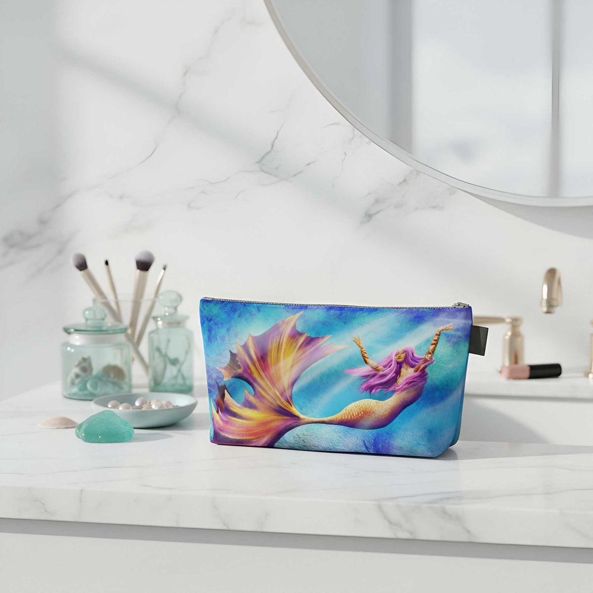 mermaid makeup bag on bathroom counter with cosmetics and decor