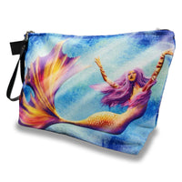 front view of mermaid makeup bag with colorful artwork of a mermaid dancing underwater