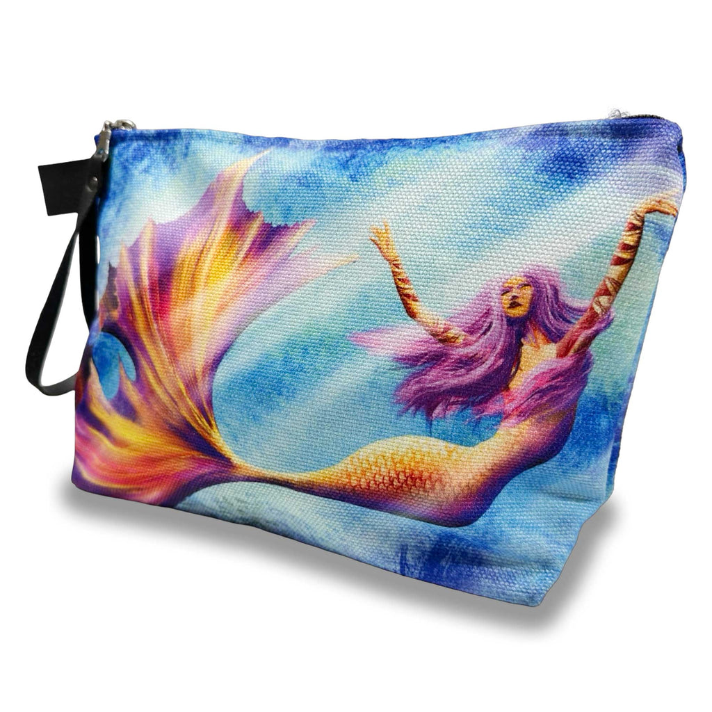 front view of mermaid makeup bag with colorful artwork of a mermaid dancing underwater