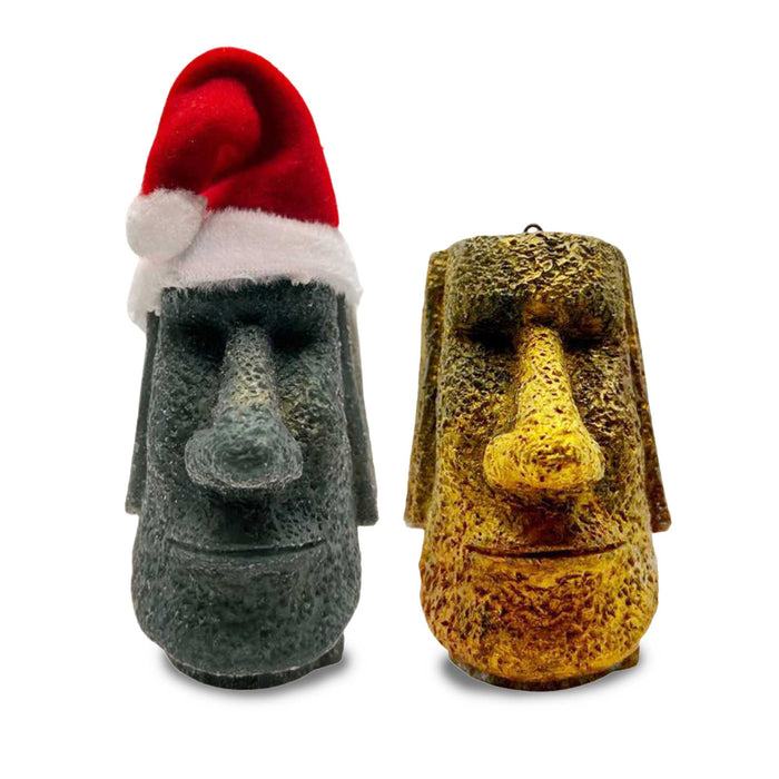 handmade tiki moai resin ornaments with weathered stone texture and metallic gold inclusions.  One wears a santa hat.