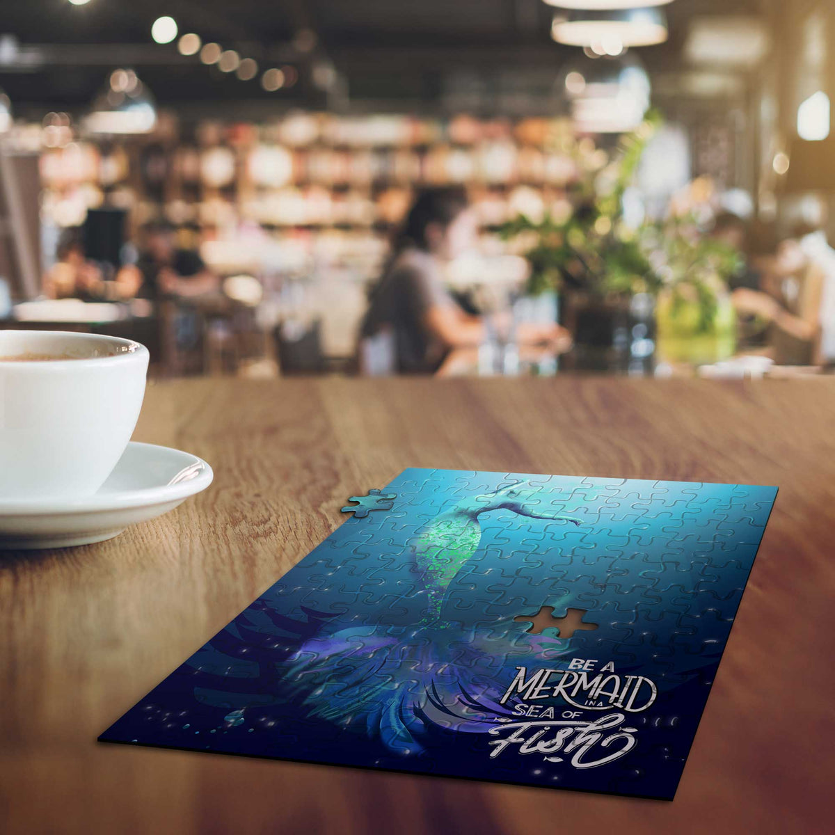 Mini art puzzle displayed on a cafe table during a relaxing coffee break, calming creative activity