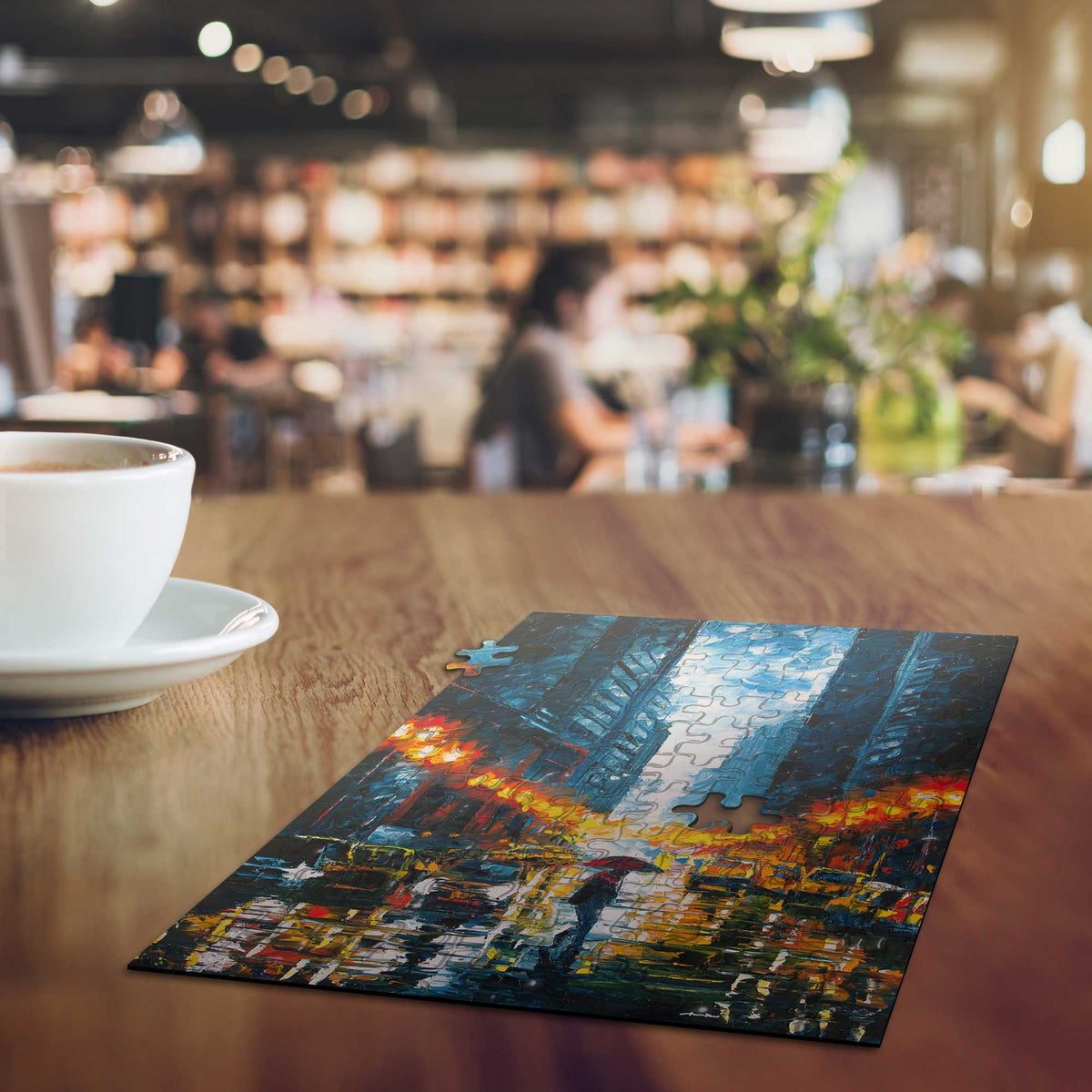 A small, nearly completed mini-art puzzle resting on a coffee table in a warm, cozy coffee shop.
