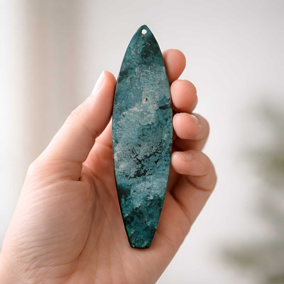 hand painted surfboard ornament held in hand showing small 6 inch size