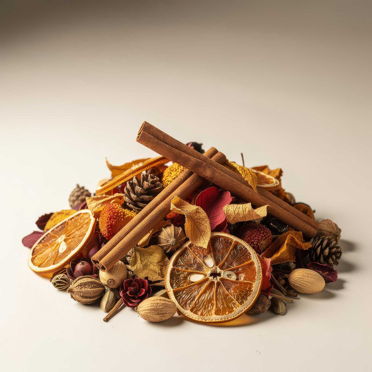 A mix of potpourri including natural materials on a white surface