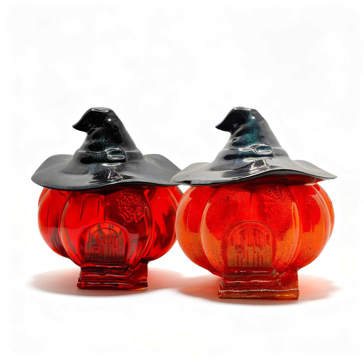 Two glass pumpkin jars with witch hats for Halloween decor