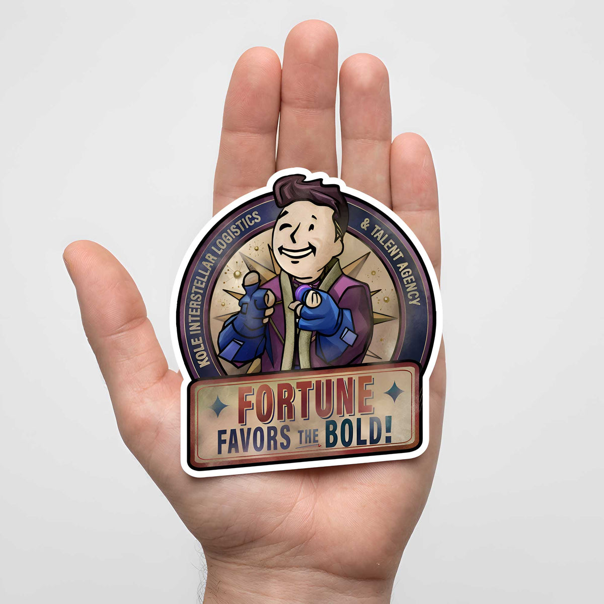 Raithe Kole Fortune Favors the Bold sticker shown in hand for scale