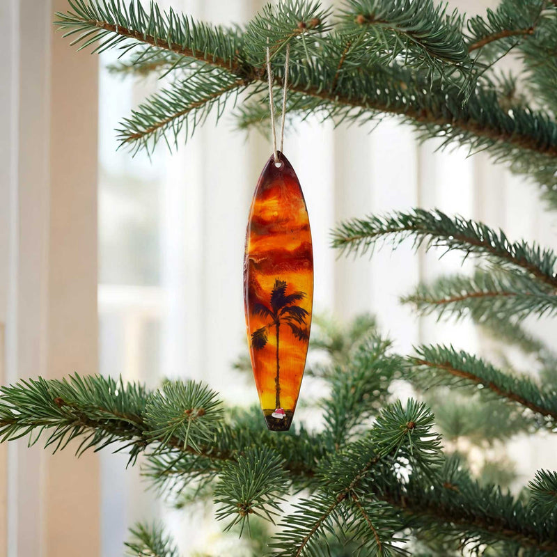 santa’s getaway surfboard ornament hanging on christmas tree