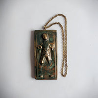 han solo in carbonite ornament with antique gold chain on white background