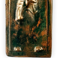 close up texture detail of han solo carbonite holiday ornament with weathered bronze finish