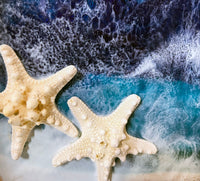 close up of resin ocean texture with starfish details