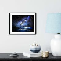 Framed starry night ocean painting displayed in modern minimalist interior with soft coastal styling
