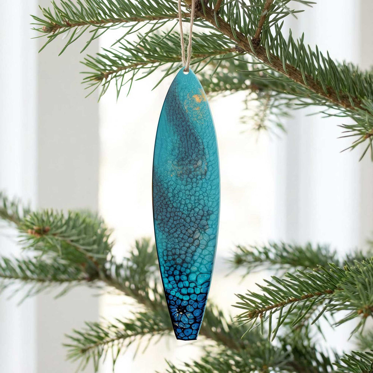 surf n’ stars surfboard ornament hanging on christmas tree