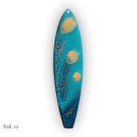 hand painted surfboard ornament with blue and teal pebeo resin and star like gold accents