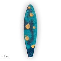 hand painted surfboard ornament with blue and teal pebeo resin and star like gold accents