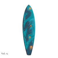 hand painted surfboard ornament with blue and teal pebeo resin and star like gold accents