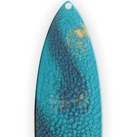 close up of blue resin texture on surfboard holiday ornament