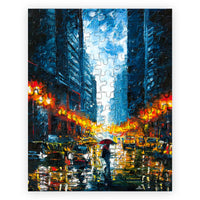 110 piece mini art puzzle featuring a rainy urban city scene with reflections and warm streetlights