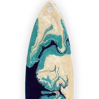 close up of pebeo resin flow and texture on by the sea surfboard ornament