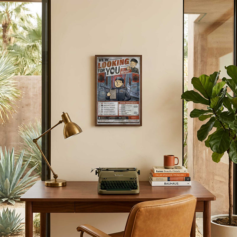 We’re Looking for You Lt. Croy art print displayed in a warm Palm Springs style office