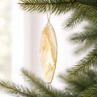 Coastal Christmas tree ornaments on a beach themed Christmas tree with white and gold Christmas tree decor by 5th & Rugged.
