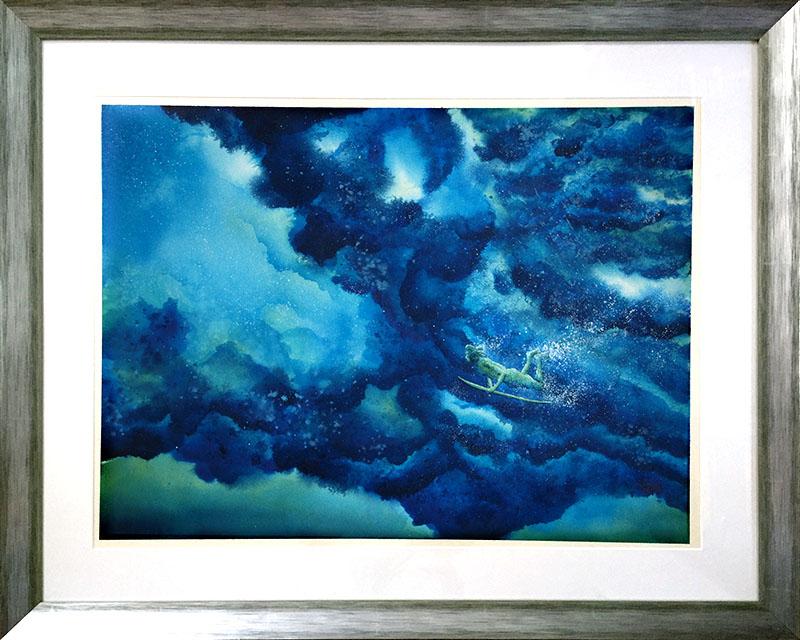 Framed wall art of a SoCal surfer diving beneath a wave of rolling blue and green surf of the California coast