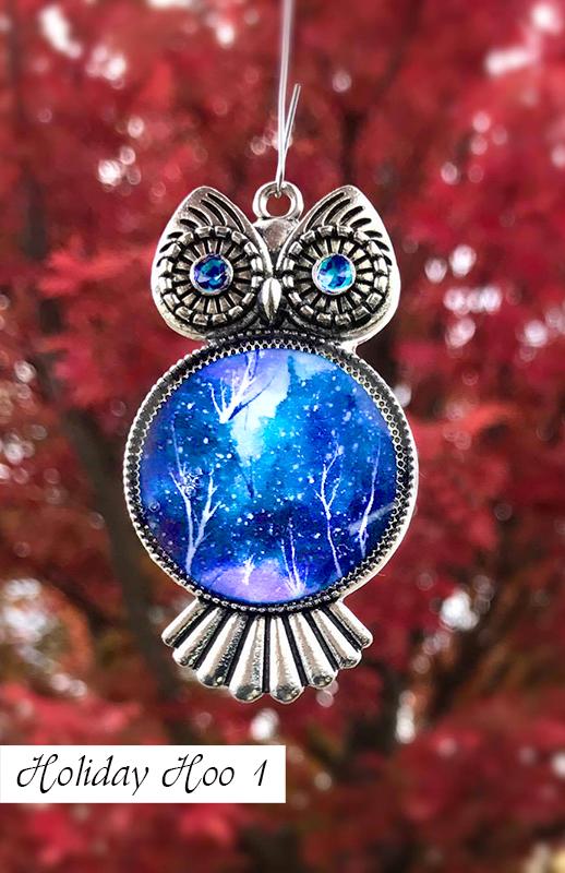 Silver owl Christmas tree ornament with blue and white painted chest and swirled eyes for blue Christmas decoration ideas.